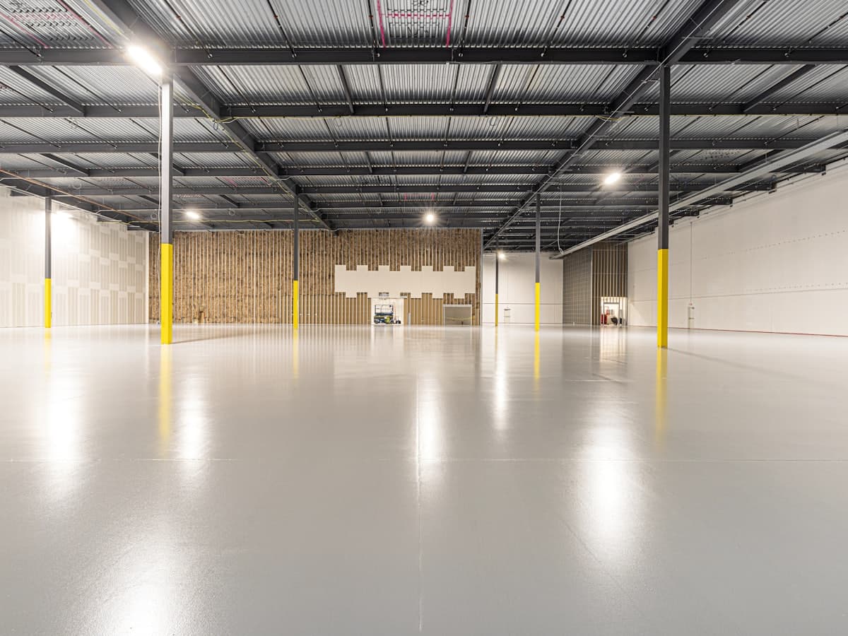 A large interior space with a smooth, polished concrete floor